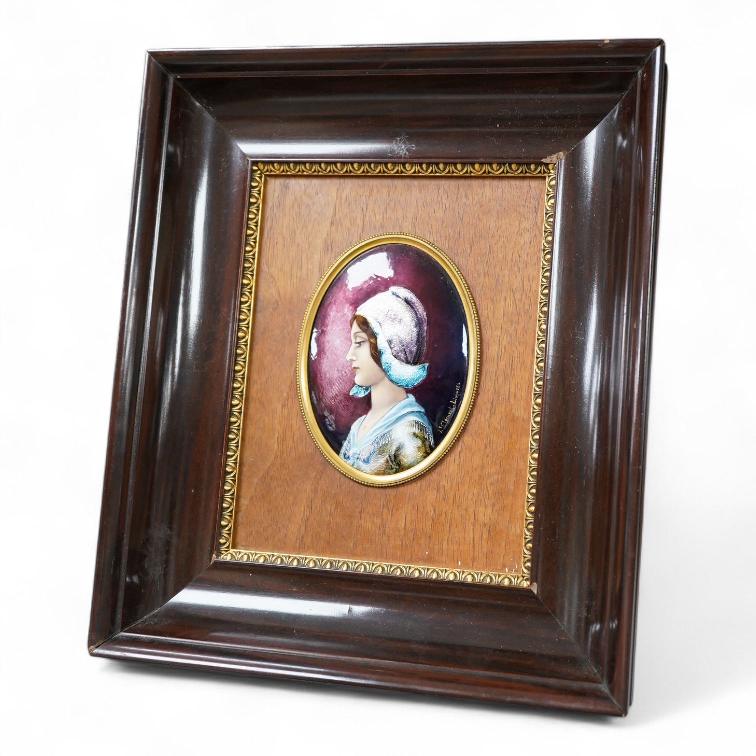 A Limoges framed oval enamel of a portrait of a lady, signed J Clement, 12cm.